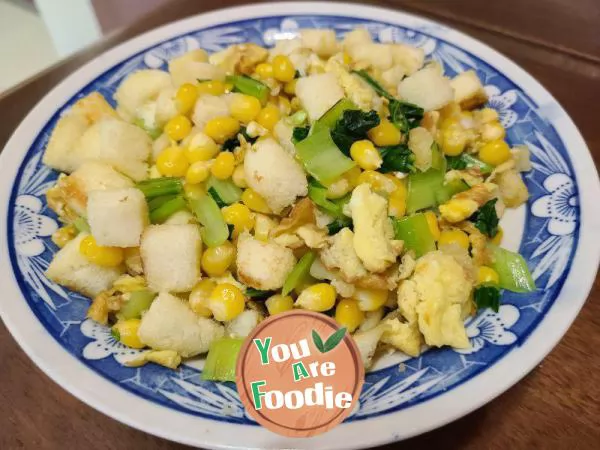 Green vegetables, corn kernels, eggs, stir fried bread cubes