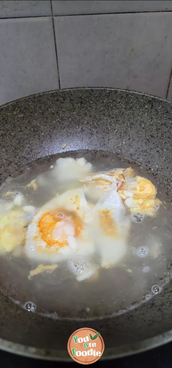 Fried egg, kelp sprouts and winter melon soup