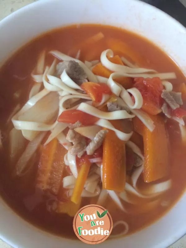 Vegetable noodles in red soup