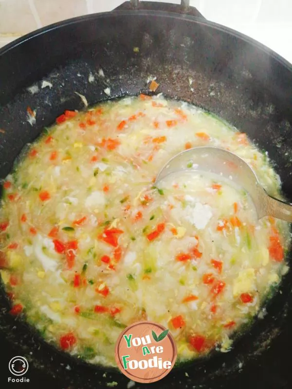 Carrot, green radish, egg noodles and pimple soup