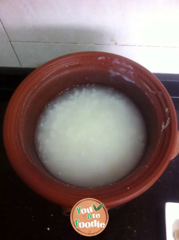 Congee with chicken balls and green vegetables