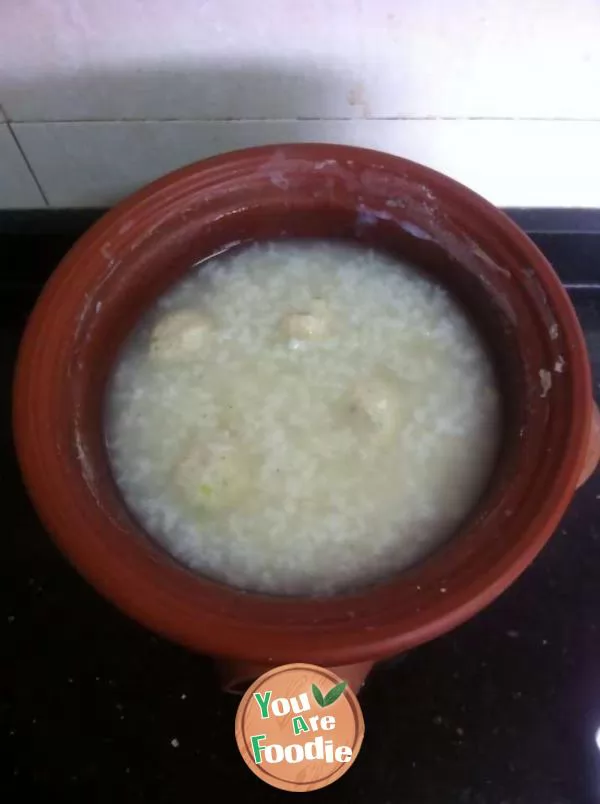 Congee with chicken balls and green vegetables