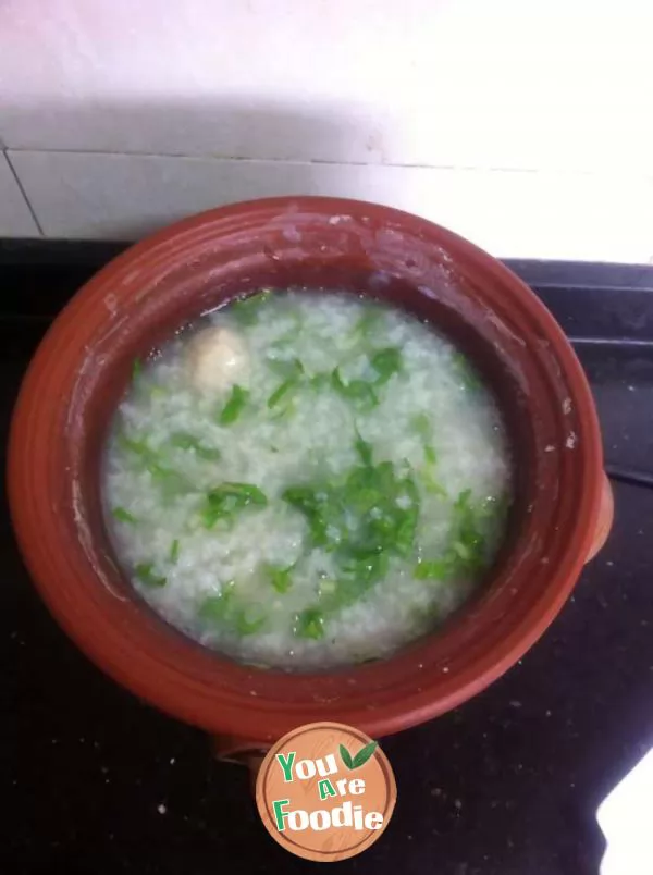 Congee with chicken balls and green vegetables