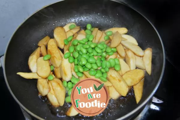 Home cooked dish in early summer - fried wild bamboo with soybean seeds