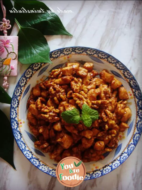 Fried diced chicken with peach kernel in soy sauce