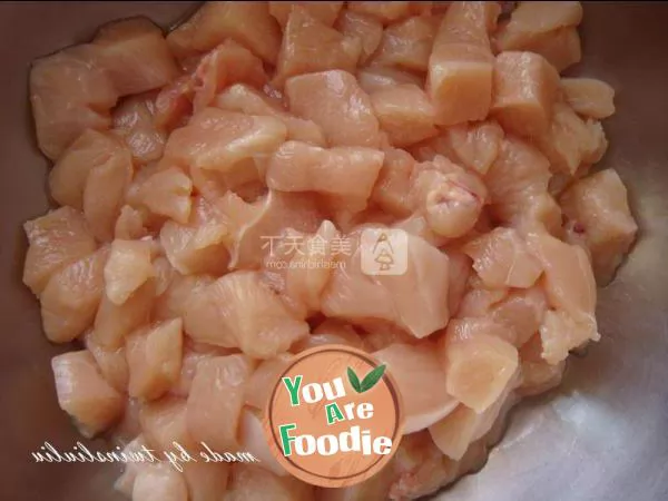 Fried diced chicken with peach kernel in soy sauce