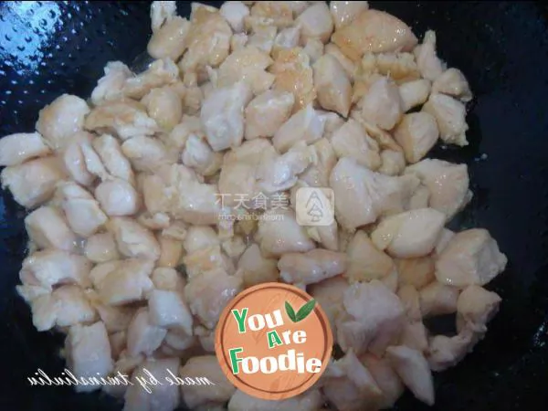 Fried diced chicken with peach kernel in soy sauce