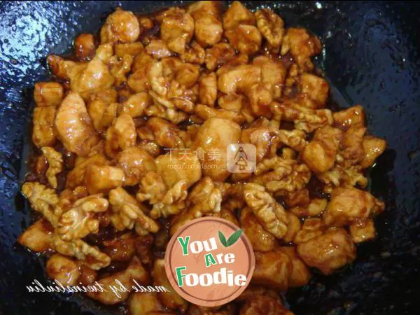 Fried diced chicken with peach kernel in soy sauce