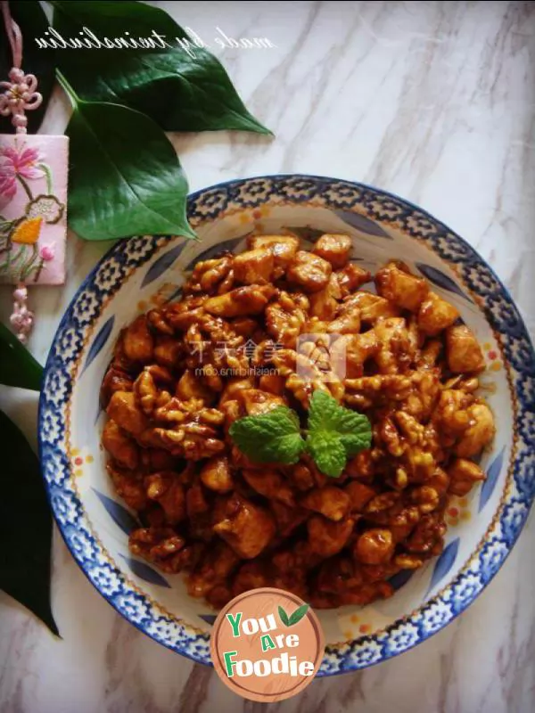 Fried diced chicken with peach kernel in soy sauce