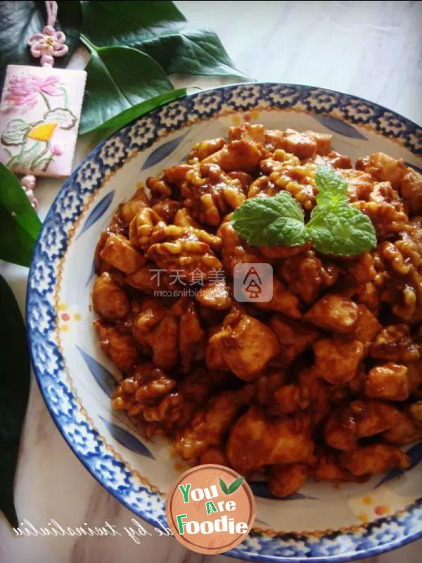 Fried diced chicken with peach kernel in soy sauce