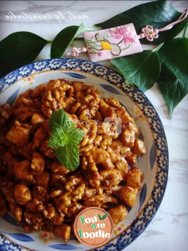 Fried diced chicken with peach kernel in soy sauce