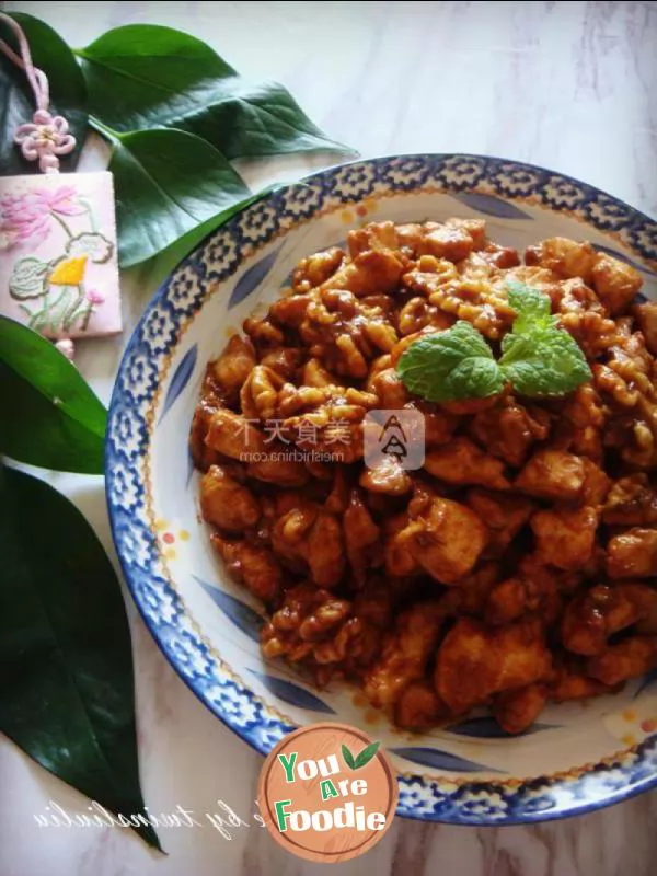 Fried diced chicken with peach kernel in soy sauce