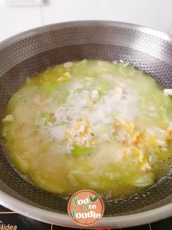 Rice with egg and towel gourd soup