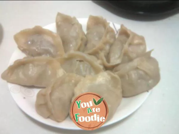 Steamed dumplings with pickled cabbage and pork stuffing