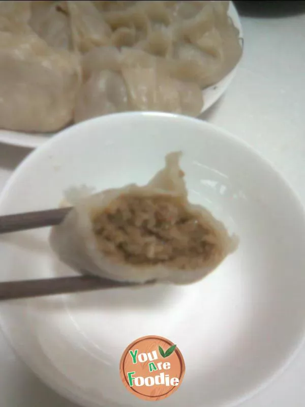 Steamed dumplings with pickled cabbage and pork stuffing