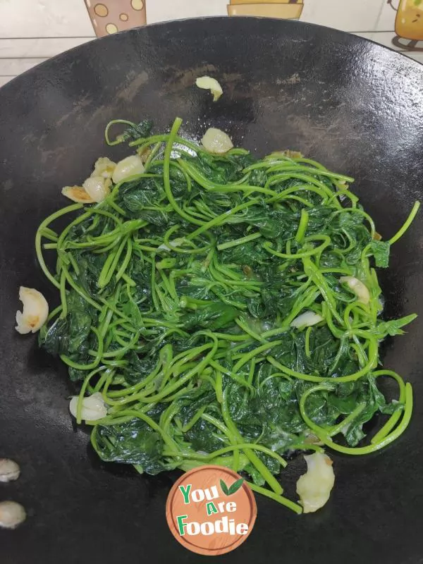 Stir fry sweet potato leaves with chili sauce