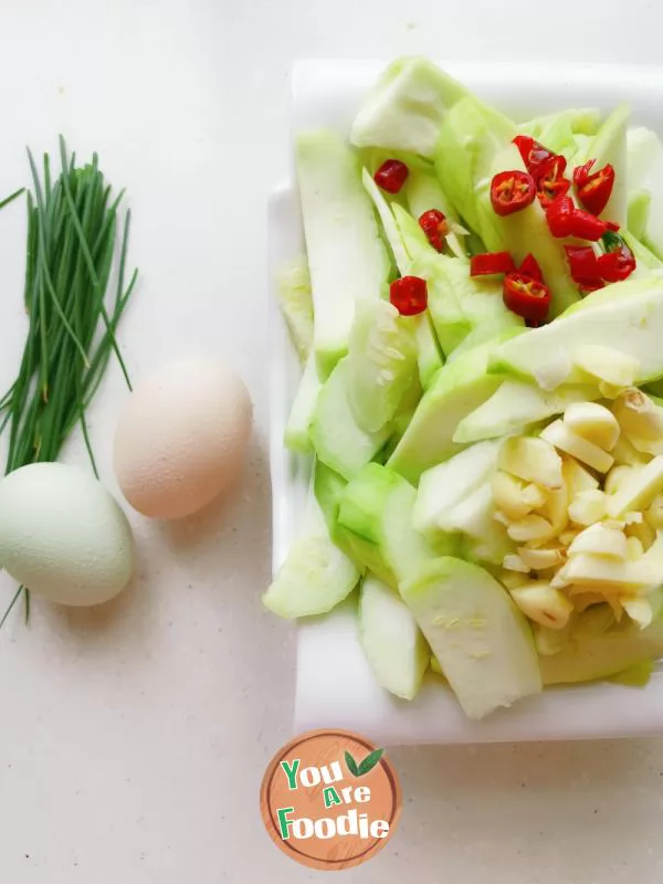 Fried poached egg with towel gourd