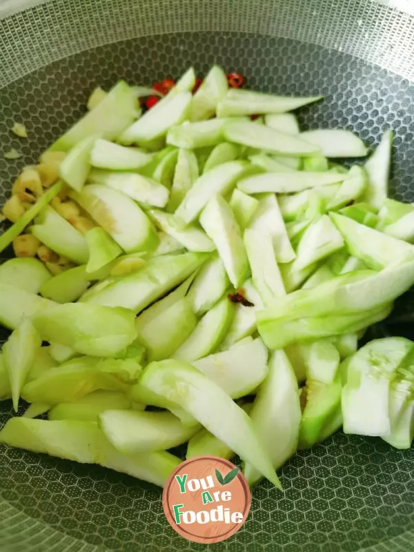 Fried poached egg with towel gourd