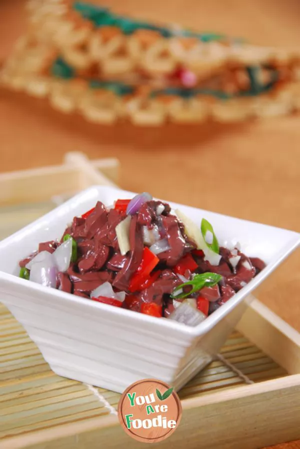 Fried duck blood with onion and pepper