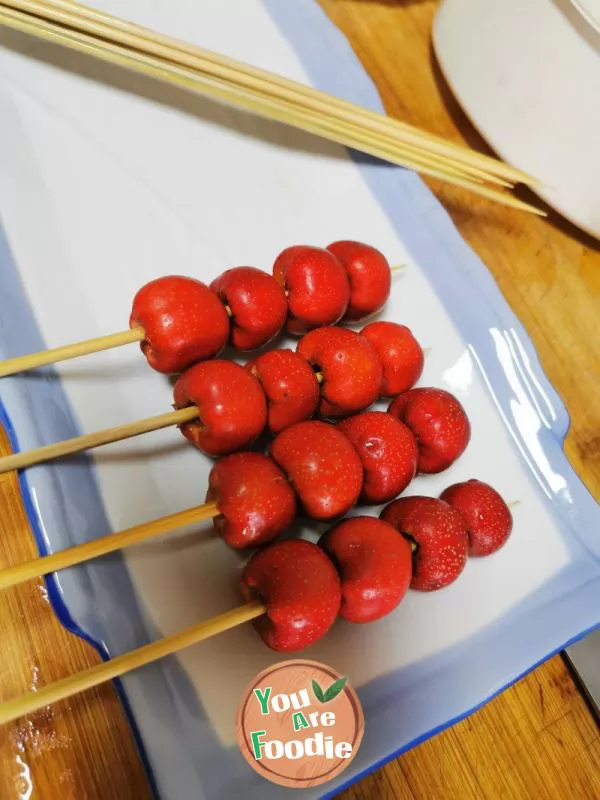 candied gourd on a stick