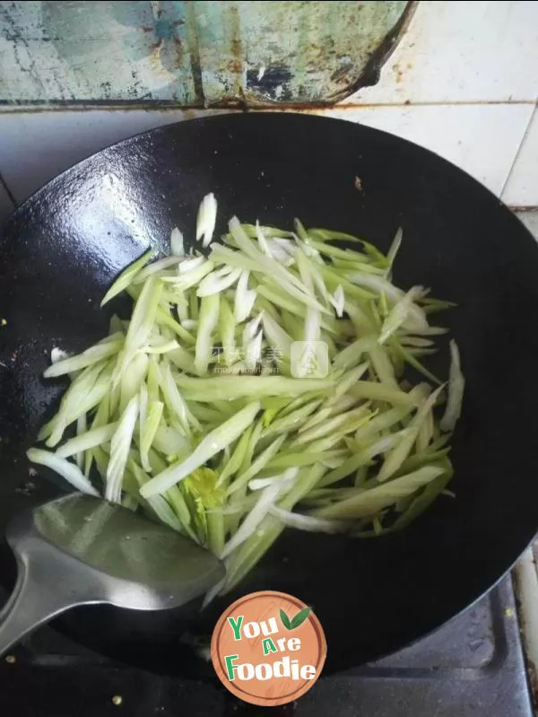 Fried sausage with celery