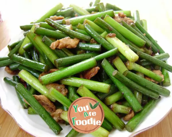 Home cooked dish - fried meat with garlic stalks