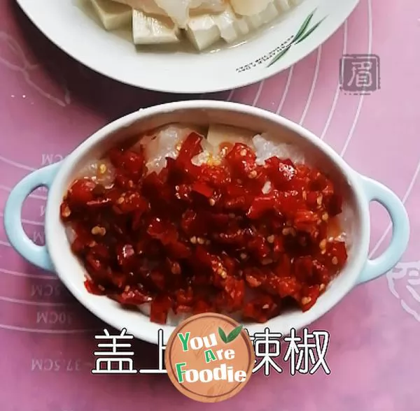 Steamed tofu with fish slices with chopped peppers