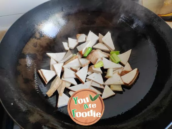 Stir fried dried tofu with garlic sprouts