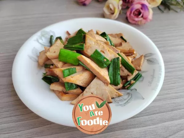 Stir fried dried tofu with garlic sprouts