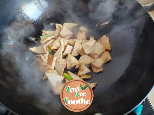 Stir fried dried tofu with garlic sprouts