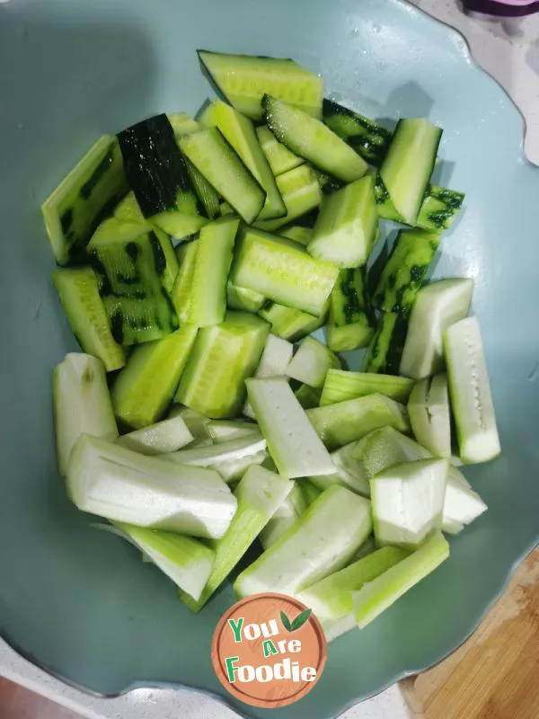 Stir fried cucumber with lotus root strips