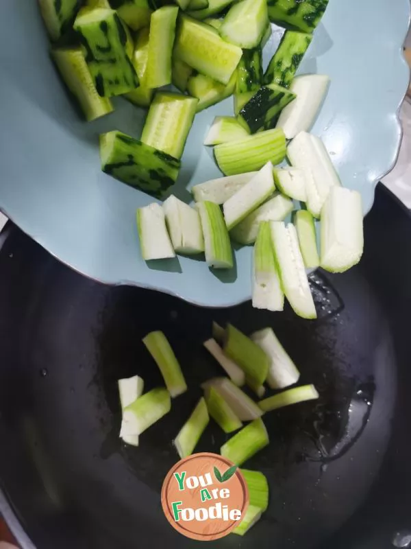 Stir fried cucumber with lotus root strips