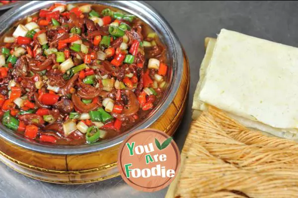 Fried meat with chili peppers