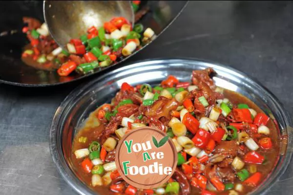 Fried meat with chili peppers