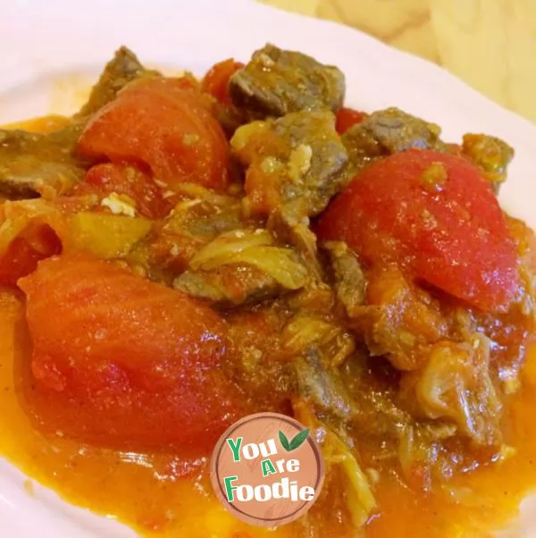 Fried beef with tomato and scallion