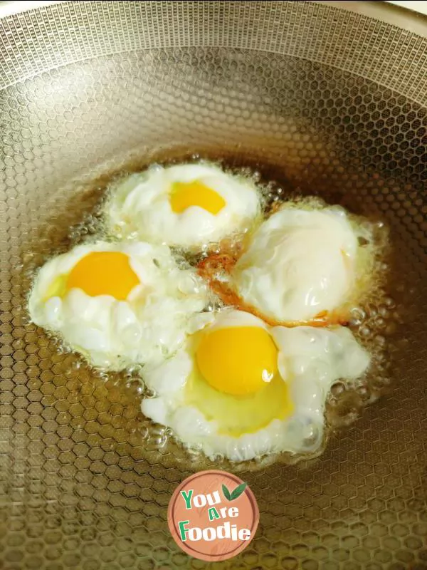 Fried eggs with garlic sprouts