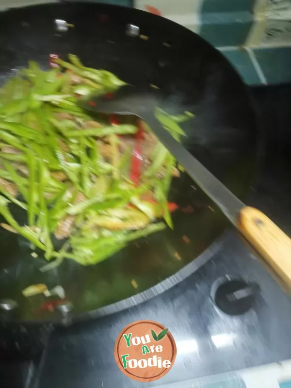 Fried meat with garlic sprouts