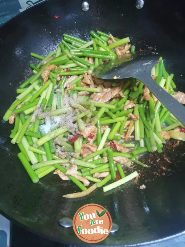 Fried meat with garlic sprouts