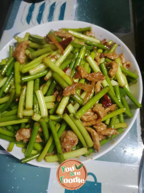 Fried meat with garlic sprouts