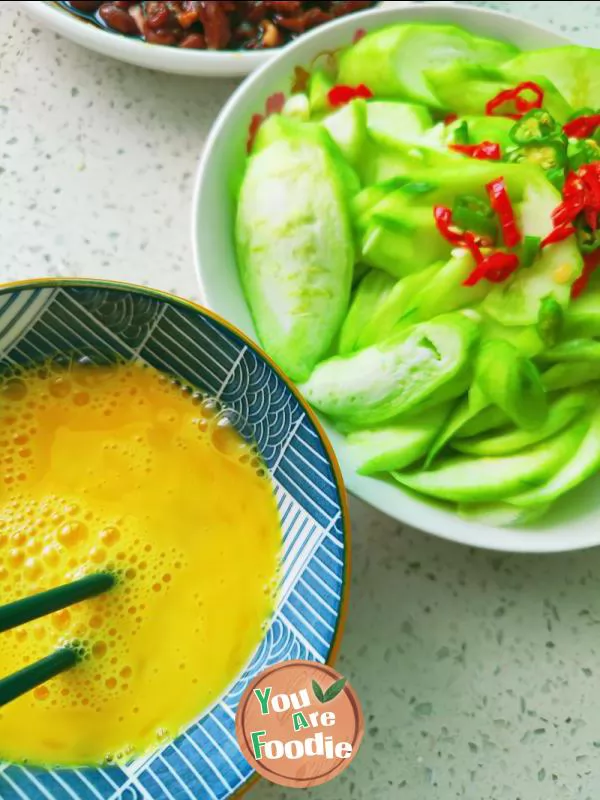 Fried egg with towel gourd