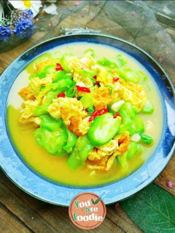 Fried egg with towel gourd