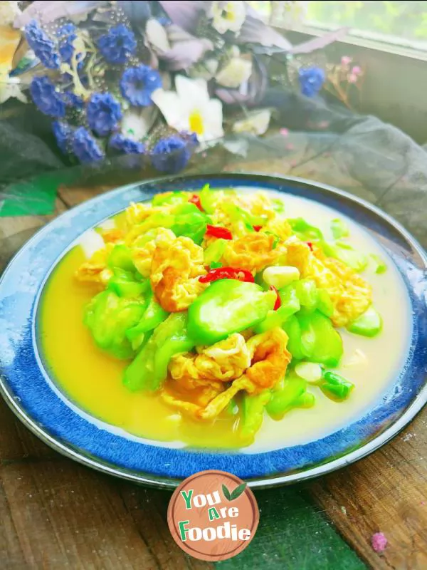 Fried egg with towel gourd