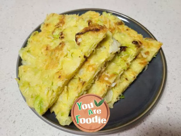 Fried pancakes with shredded cabbage and eggs