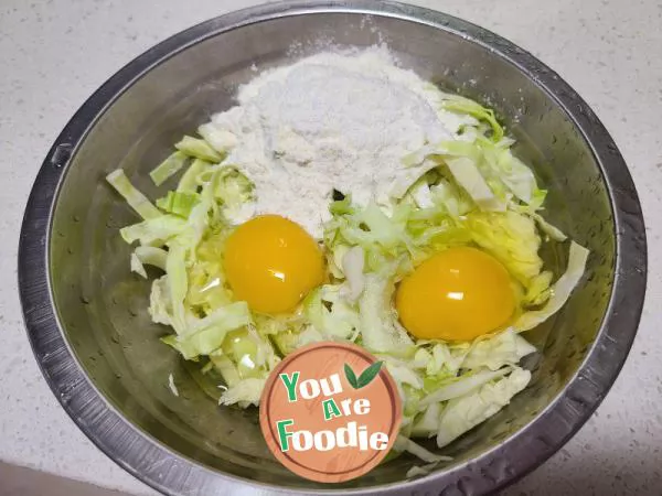 Fried pancakes with shredded cabbage and eggs