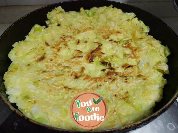 Fried pancakes with shredded cabbage and eggs