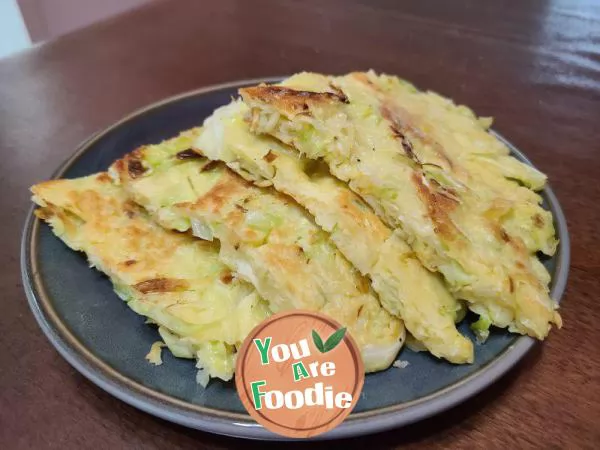 Fried pancakes with shredded cabbage and eggs