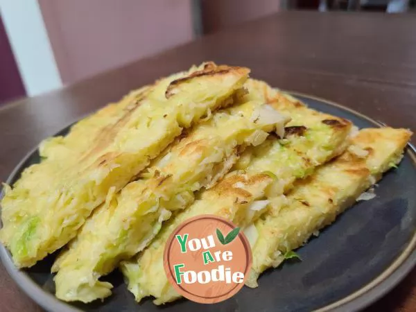 Fried pancakes with shredded cabbage and eggs