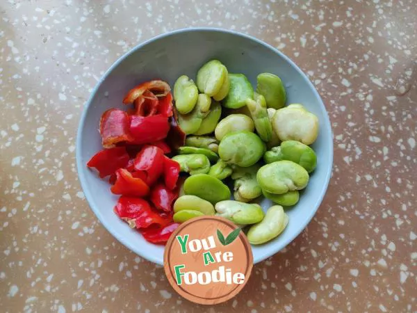 Stir fried eggs with red pepper and broad beans