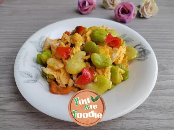 Stir fried eggs with red pepper and broad beans