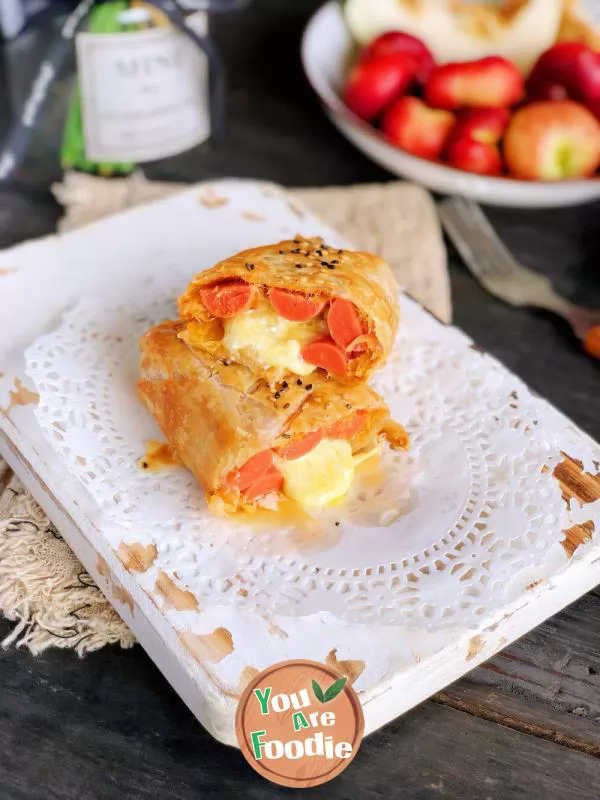 Hand-Grasping-Cake-and-Flowing-Heart-Breakfast-Roll